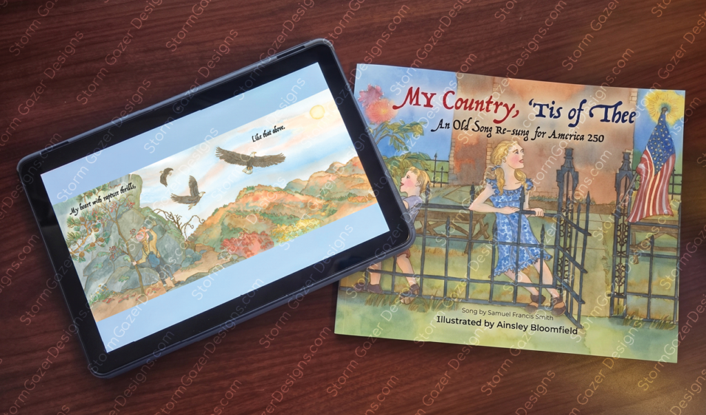 A tablet displaying a digital eBook layout next to the physical paperback cover of the children's book My Country, 'Tis of Thee illustrated by Ainsley Bloomfield.